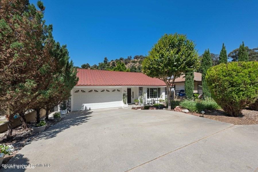 421 Cloverleaf Drive Monrovia, CA 91016 - Photo 2 of 21 a view of a patio with a table and chairs under an umbrella