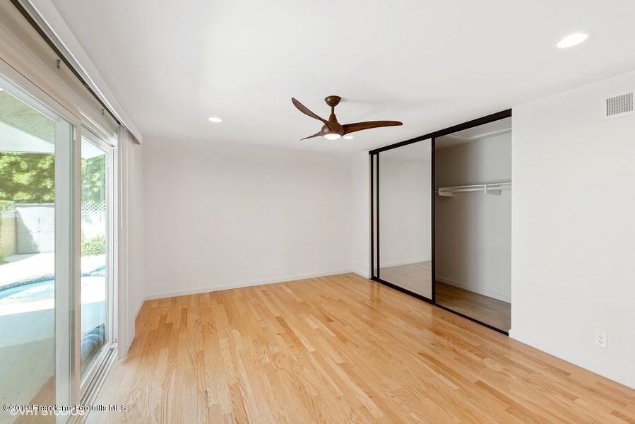 421 Cloverleaf Drive Monrovia, CA 91016 - Photo 12 of 21 a view of empty room with wooden floor and fan
