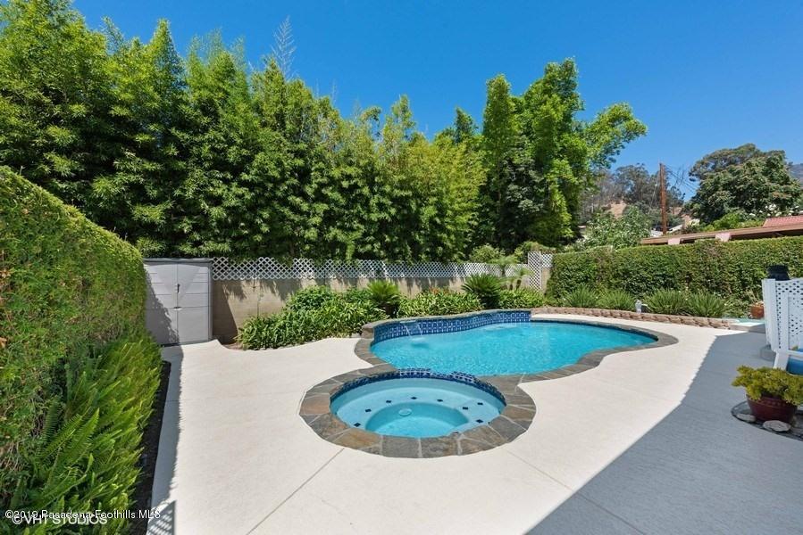 421 Cloverleaf Drive Monrovia, CA 91016 - Photo 20 of 21 a view of a swimming pool with a outdoor seating and plants