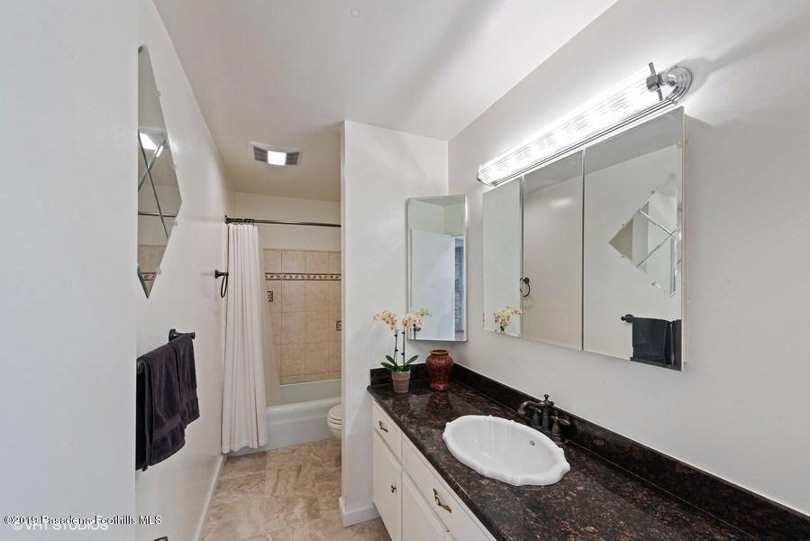 421 Cloverleaf Drive Monrovia, CA 91016 - Photo 9 of 21 a bathroom with a granite countertop sink toilet and shower