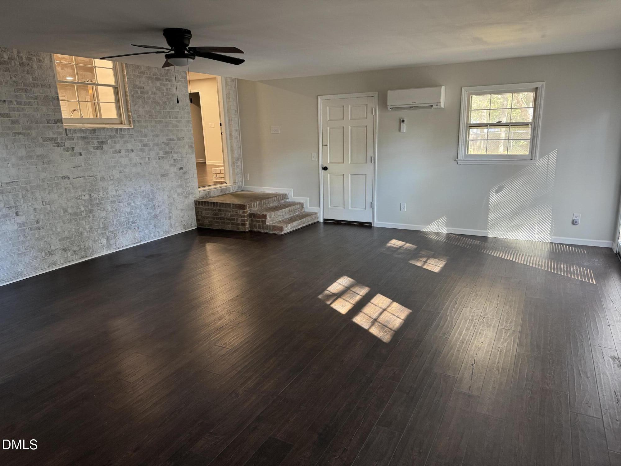 11993 Rockside Road Middlesex, NC 27557 - Photo 12 of 15 a view of a livingroom with wooden floor and a window