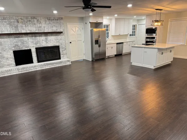 a view of kitchen with sink and microwave