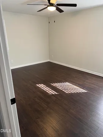 a view of room with wooden floor