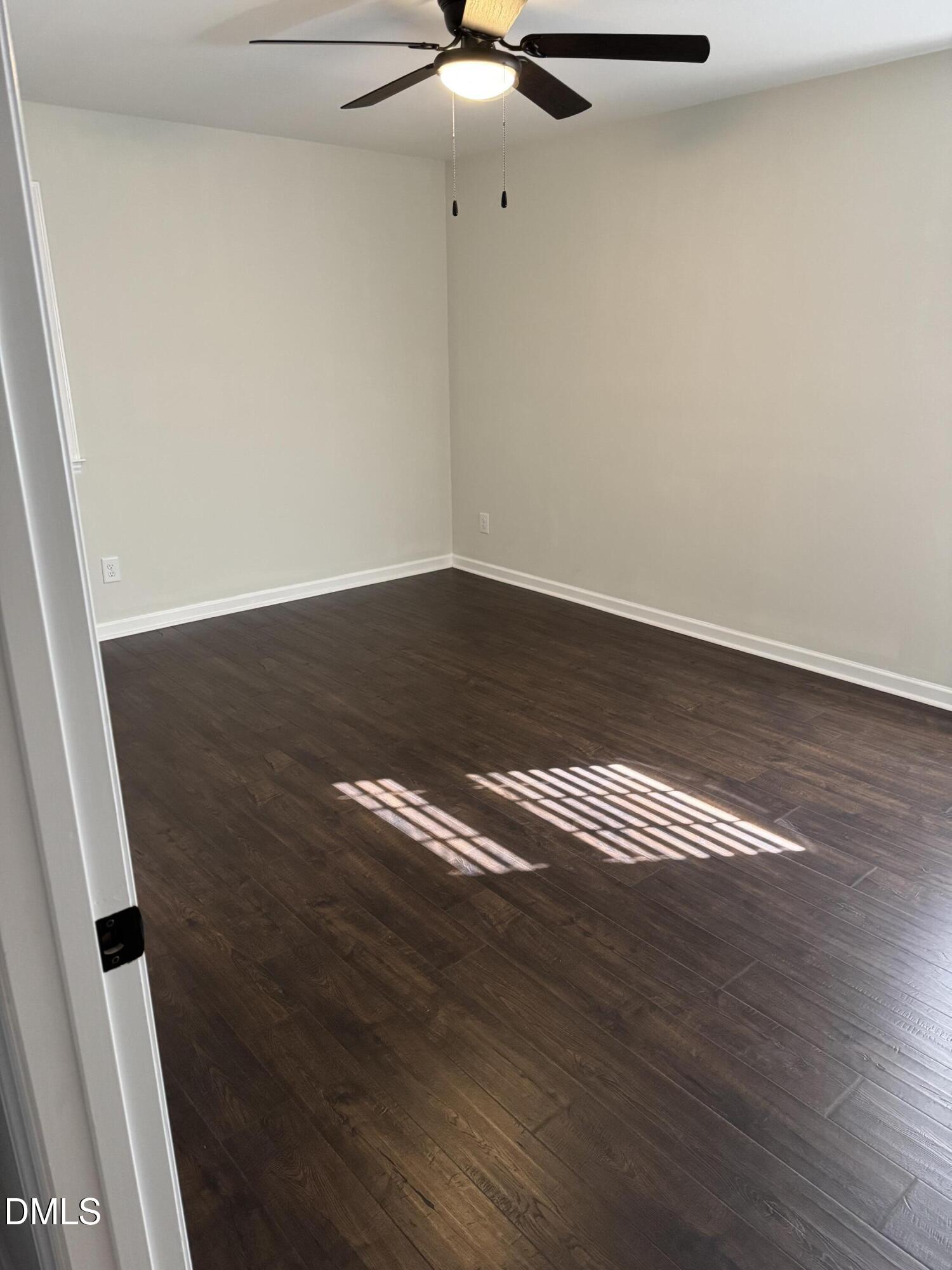 11993 Rockside Road Middlesex, NC 27557 - Photo 5 of 15 a view of room with wooden floor