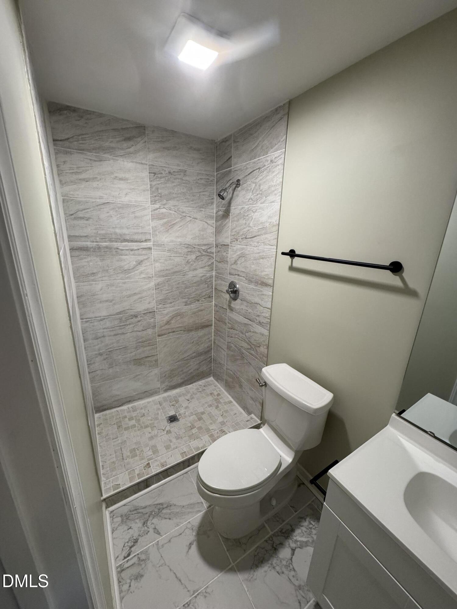 11993 Rockside Road Middlesex, NC 27557 - Photo 6 of 15 a bathroom with a toilet and a shower
