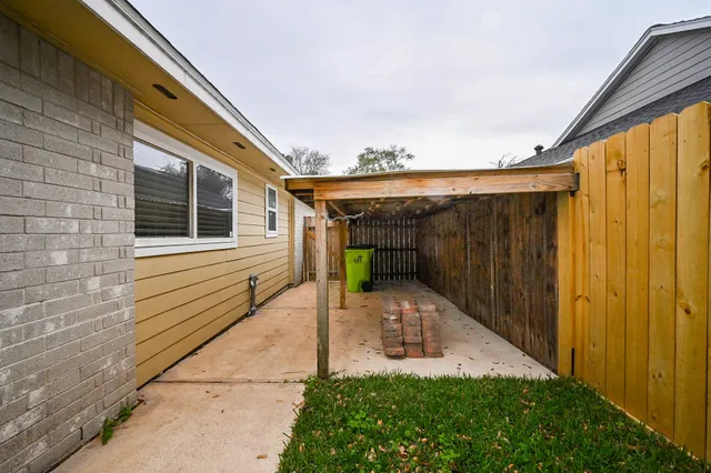 a view of yard with swimming pool and green space