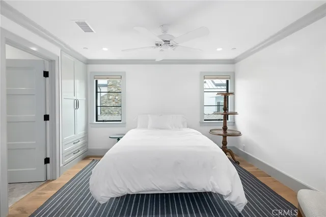 a spacious bedroom with a bed and a window