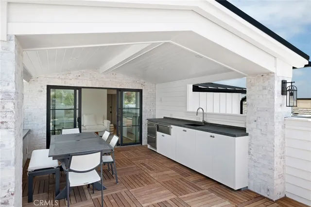 a living room with granite countertop furniture a dining table and chairs with wooden floor