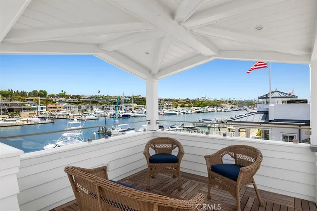 a dining room with furniture and a floor to ceiling window