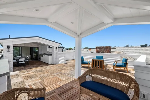 a bedroom with furniture and a large window
