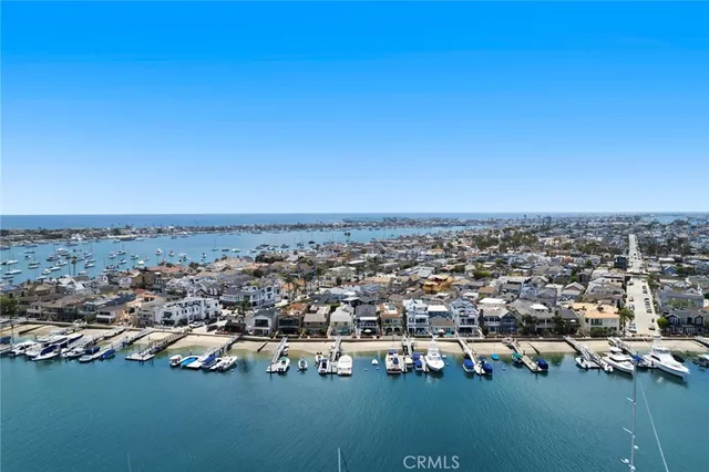 an aerial view of a city with ocean view