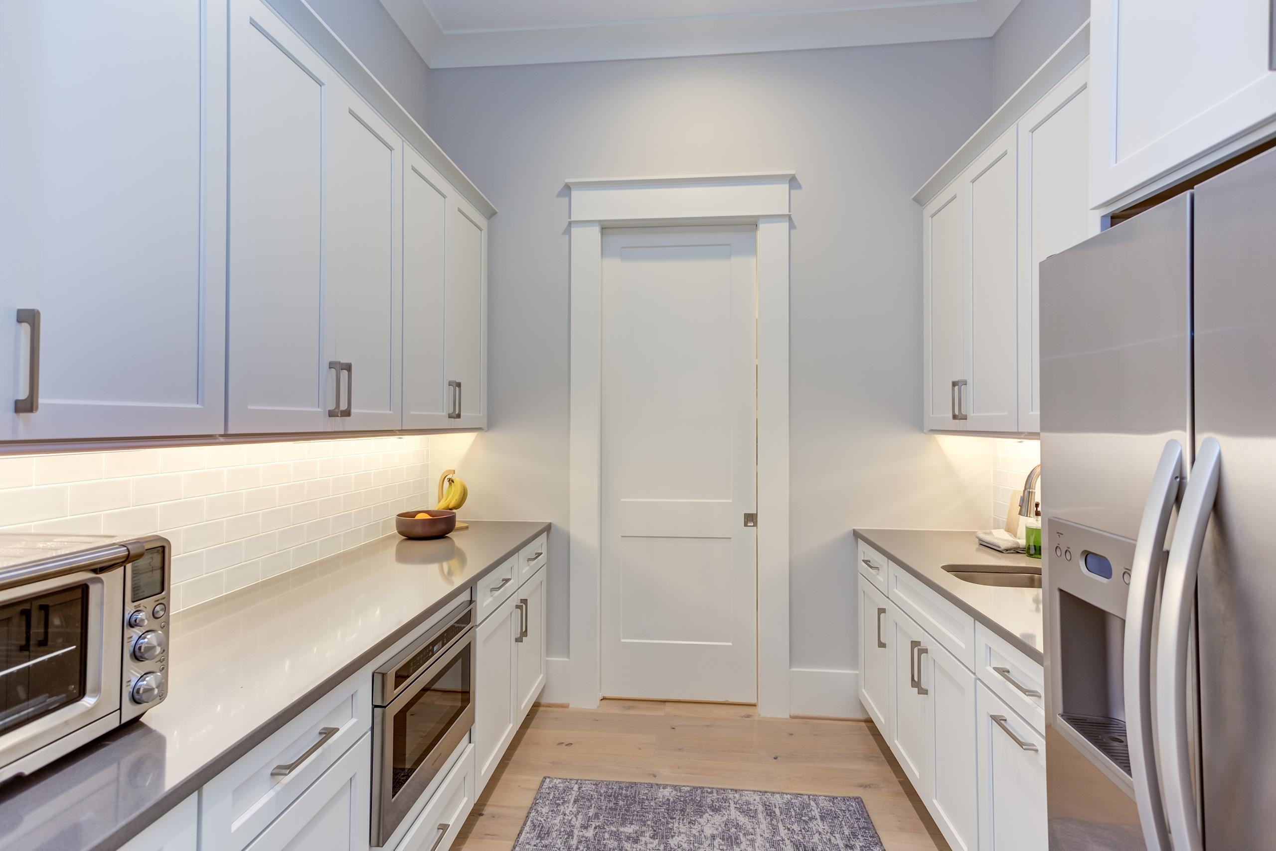 5112 Winding View Lane Raleigh, NC 27615 - Photo 28 of 71 Microwave drawer, pull out trash, prep sink, Quartz counters, under cabinet lights, full sized refrigerator, pocket door to close off from main Kitchen Scullery