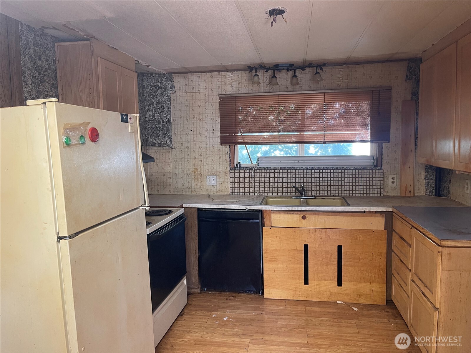 3333 228th Street Southeast, Unit 94 Bothell, WA 98021 - Photo 3 of 12 a white refrigerator freezer sitting inside of a kitchen