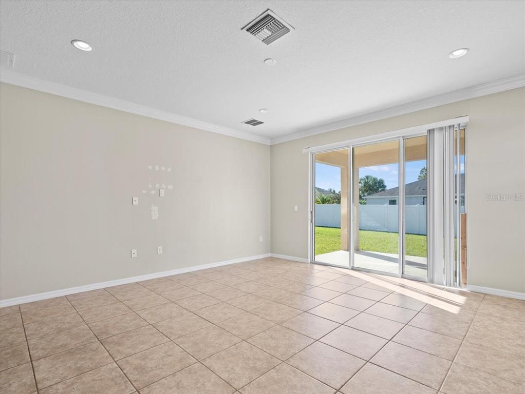 13366 Barkingside Place Spring Hill, FL 34609 - Photo 21 of 41 a view of an empty room with a window