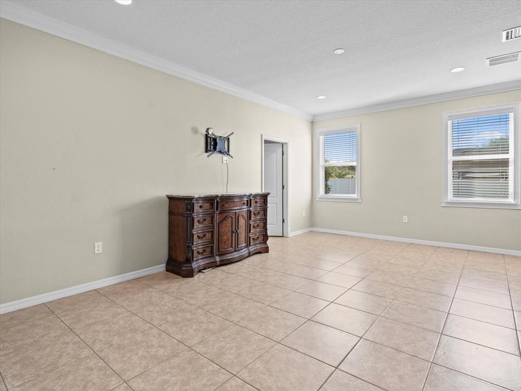 13366 Barkingside Place Spring Hill, FL 34609 - Photo 22 of 41 a view of an empty room with a window