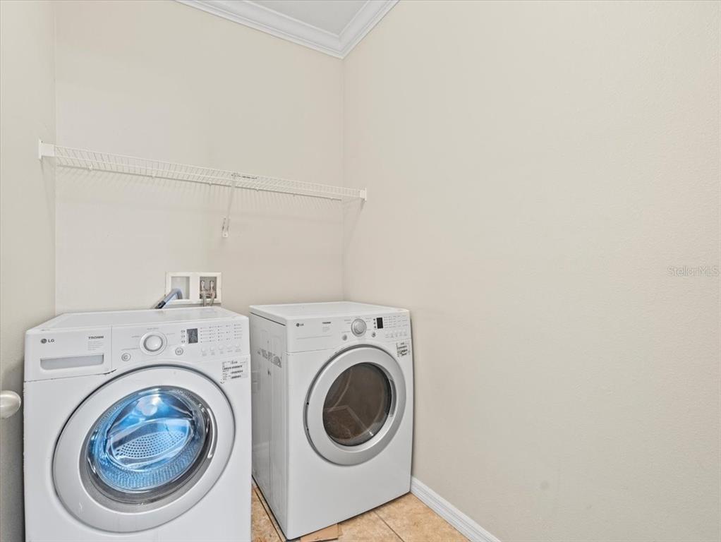 13366 Barkingside Place Spring Hill, FL 34609 - Photo 28 of 41 a utility room with dryer and washer