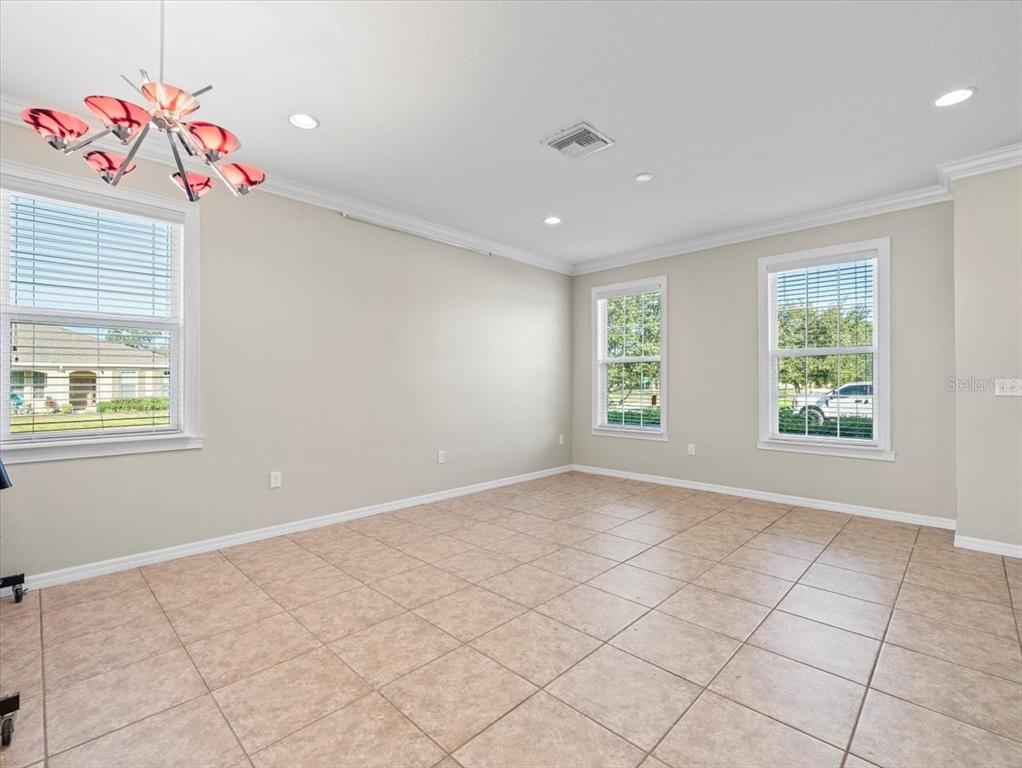 13366 Barkingside Place Spring Hill, FL 34609 - Photo 4 of 41 an empty room with windows