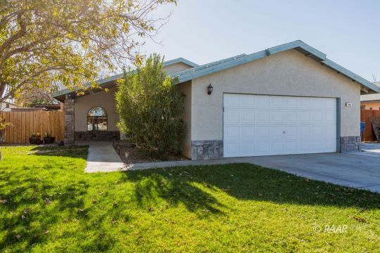 809 Charles Court Ridgecrest, CA 93555 - Photo 2 of 33 a house that has a big yard with large trees