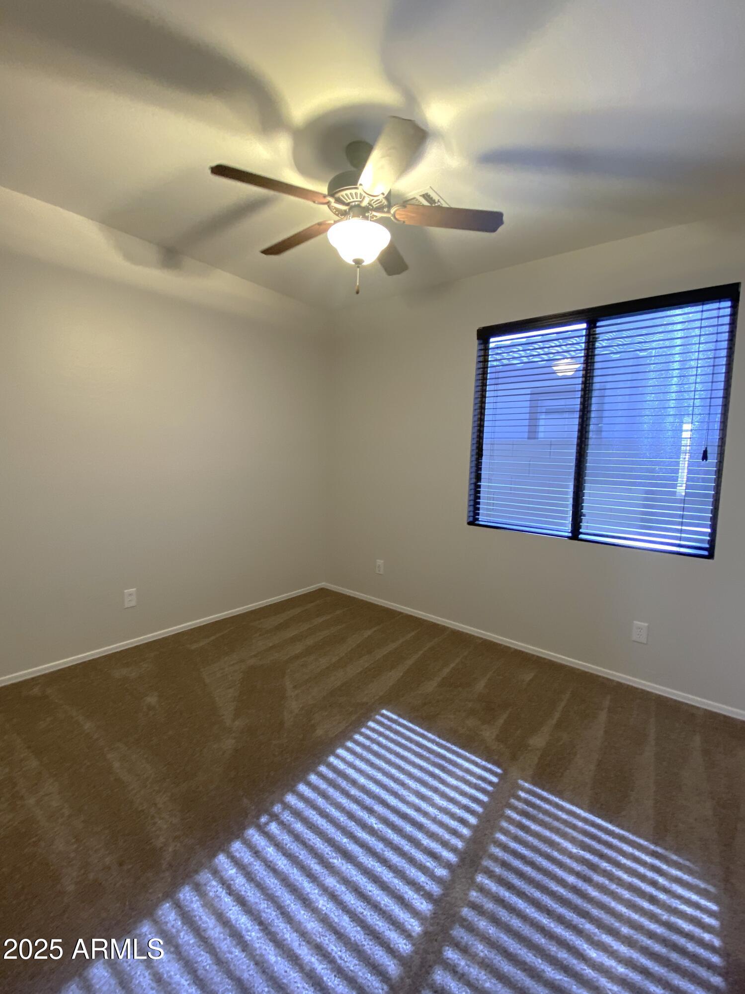 40320 North Exploration Trail Anthem, AZ 85086 - Photo 14 of 33 a view of a room with wooden floor and cabinet