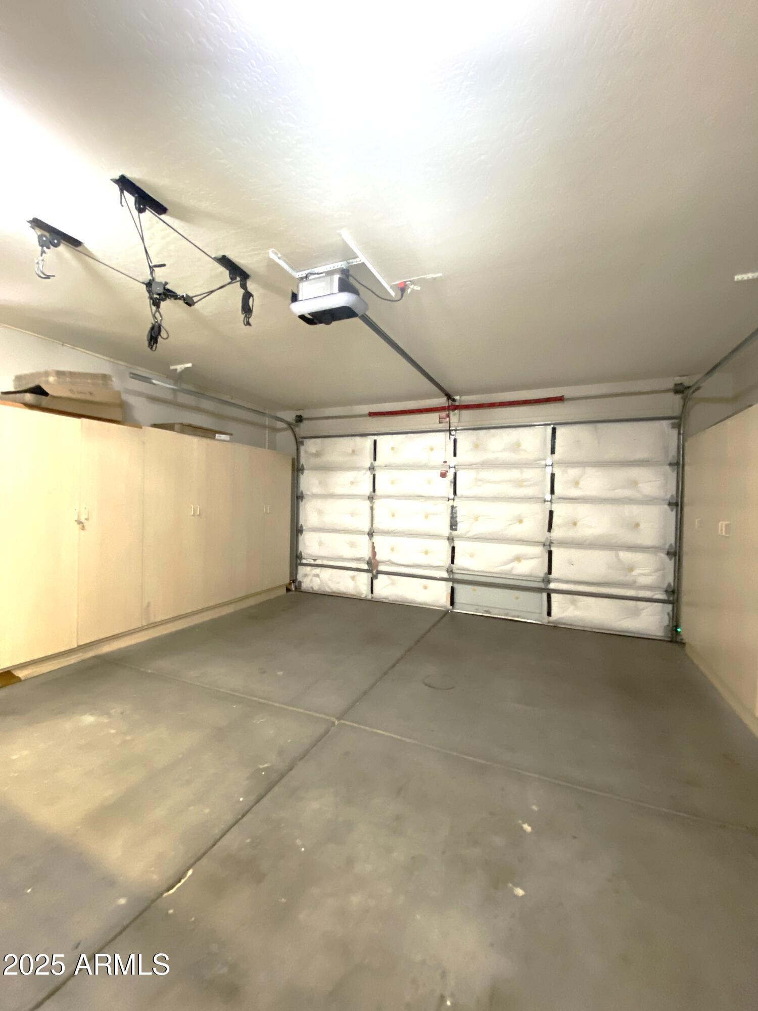 40320 North Exploration Trail Anthem, AZ 85086 - Photo 19 of 33 a view of a room with racks on the wall