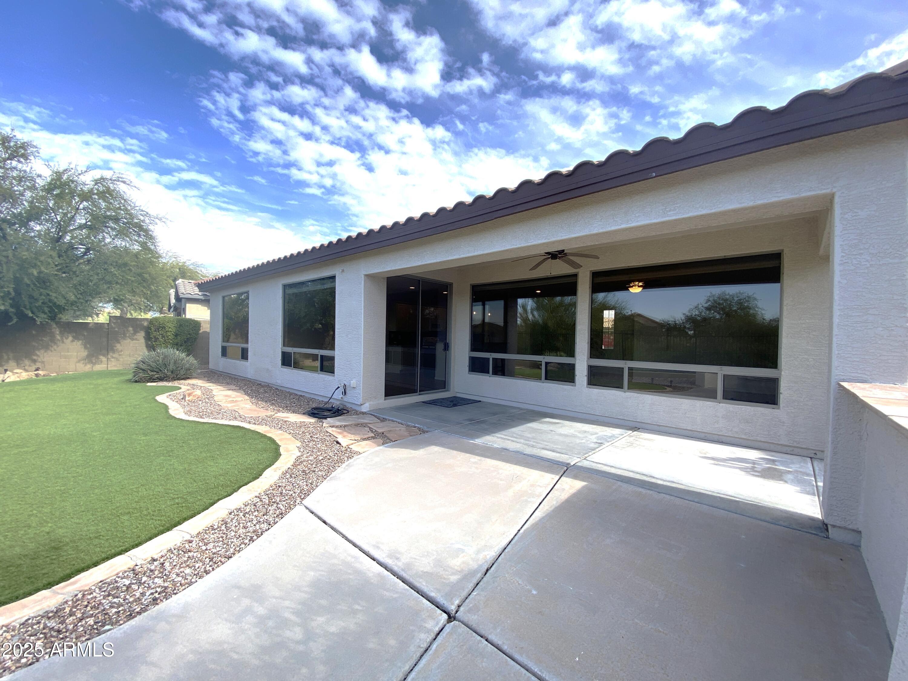 40320 North Exploration Trail Anthem, AZ 85086 - Photo 20 of 33 a view of a house with a backyard