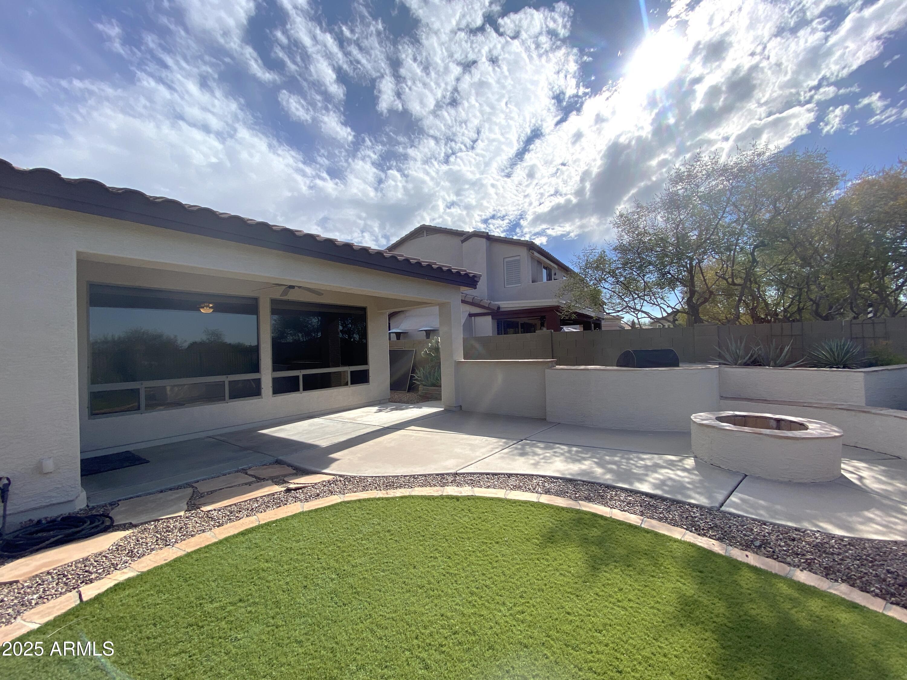 40320 North Exploration Trail Anthem, AZ 85086 - Photo 21 of 33 a view of a house with backyard porch and sitting area