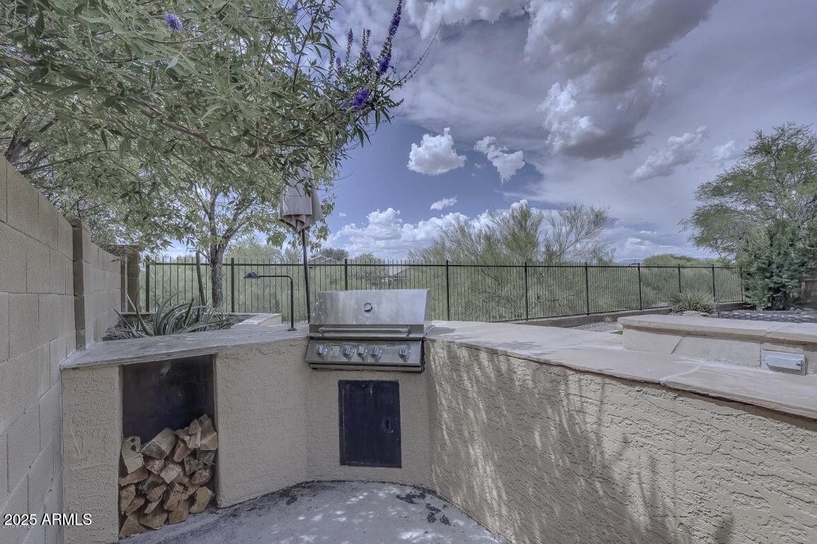 40320 North Exploration Trail Anthem, AZ 85086 - Photo 22 of 33 a view of a backyard with iron fence