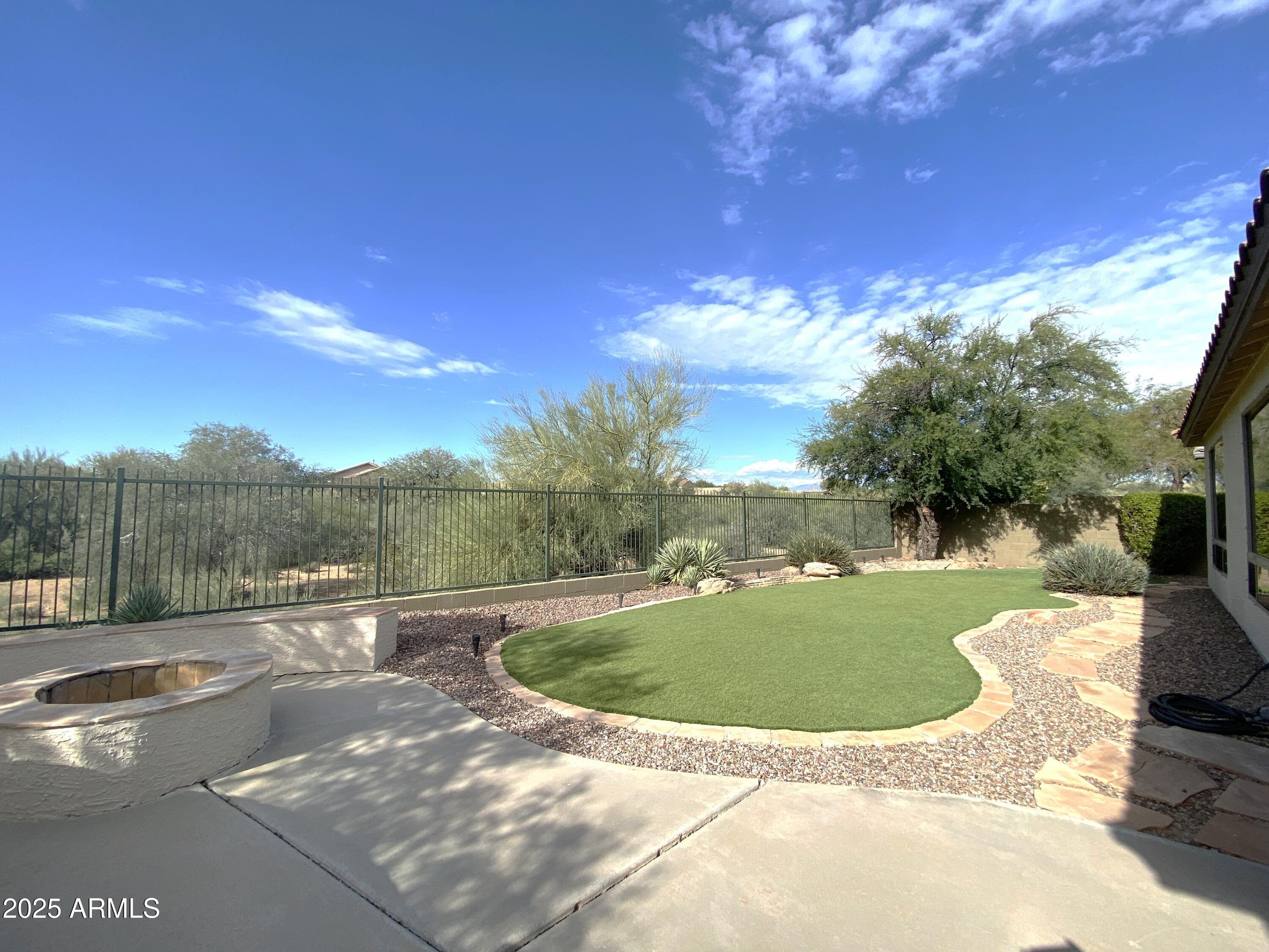 40320 North Exploration Trail Anthem, AZ 85086 - Photo 26 of 33 a view of a swimming pool with a yard