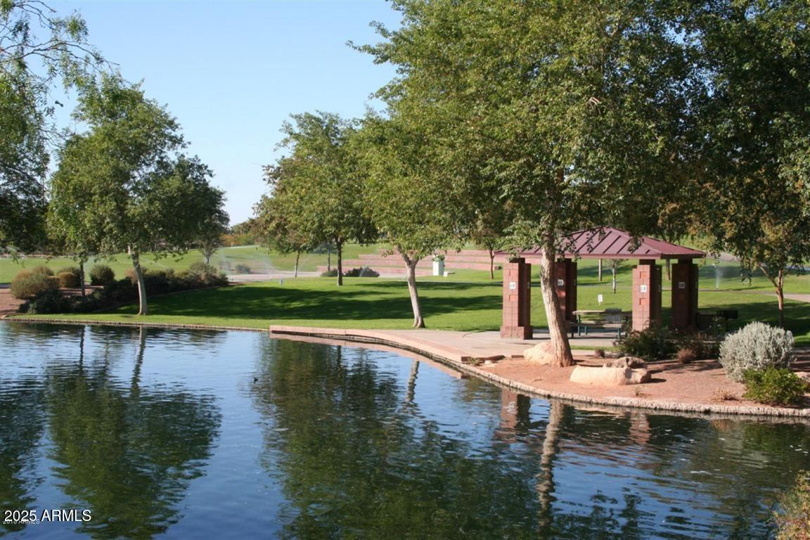40320 North Exploration Trail Anthem, AZ 85086 - Photo 28 of 33 a view of a lake with a swimming pool
