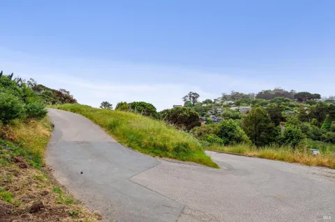 a view of a lake with houses in the back
