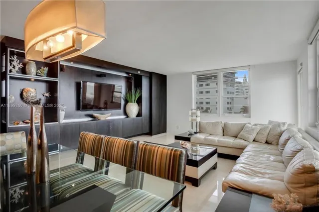 a living room with furniture and a large mirror