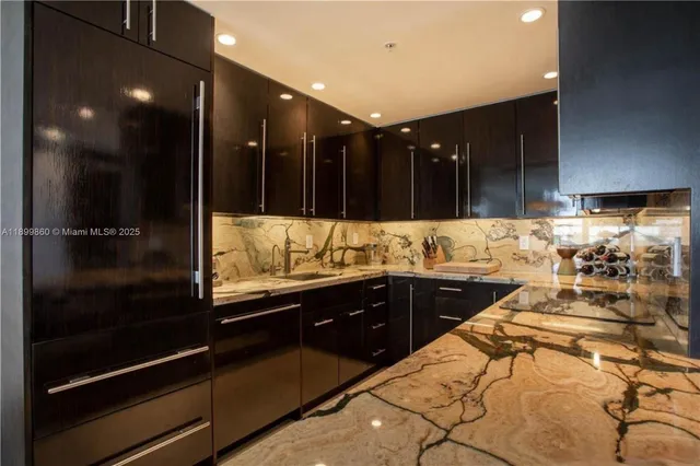 a bathroom with a large tub and sink