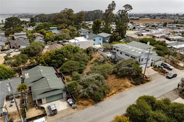 an aerial view of multiple houses with yard
