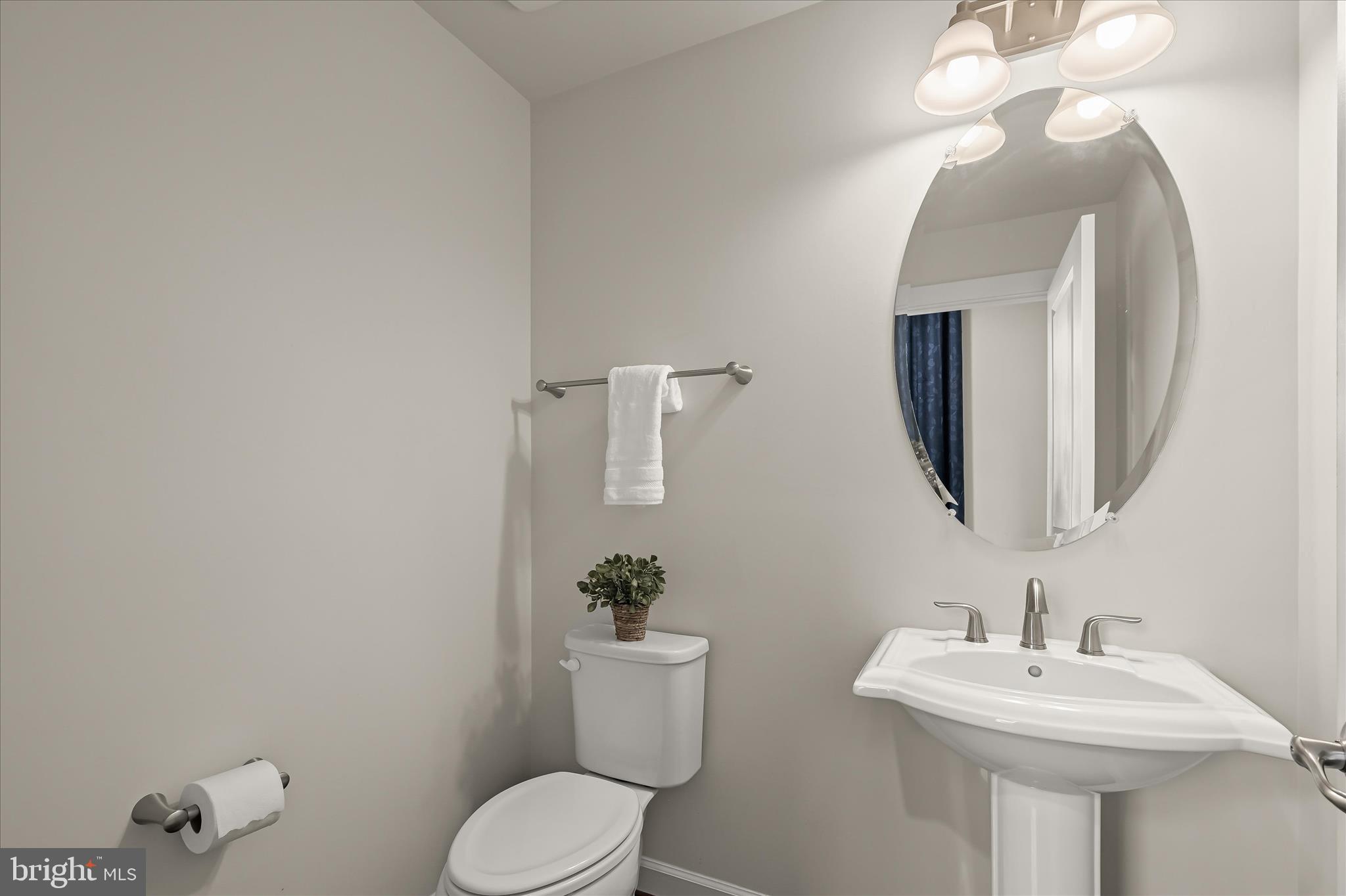 11285 Terrace Lane Fulton, MD 20759 - Photo 28 of 52 a bathroom with a toilet sink and mirror