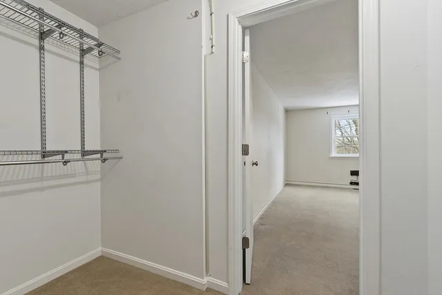 an empty room with closet area