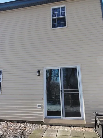 a view of a backyard with sitting area
