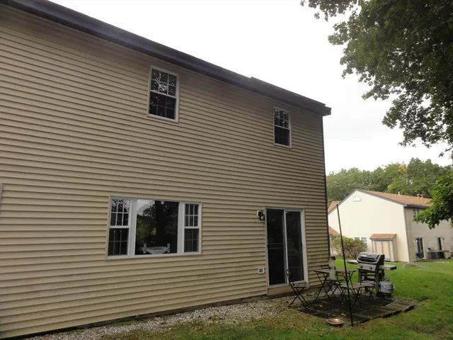 a view of a backyard with sitting area