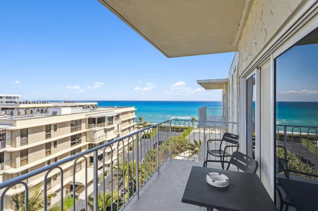 a view of a balcony with chairs