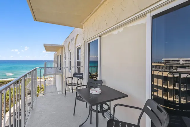 a view of a workspace with furniture