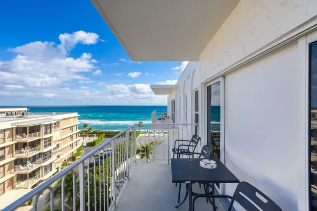 a view of a lake with a building in the background