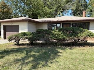 a view of a house with a garden