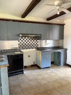 280 Rich Road Park Forest, IL 60466 - Photo 3 of 12 a kitchen with stainless steel appliances granite countertop a stove a sink and a microwave