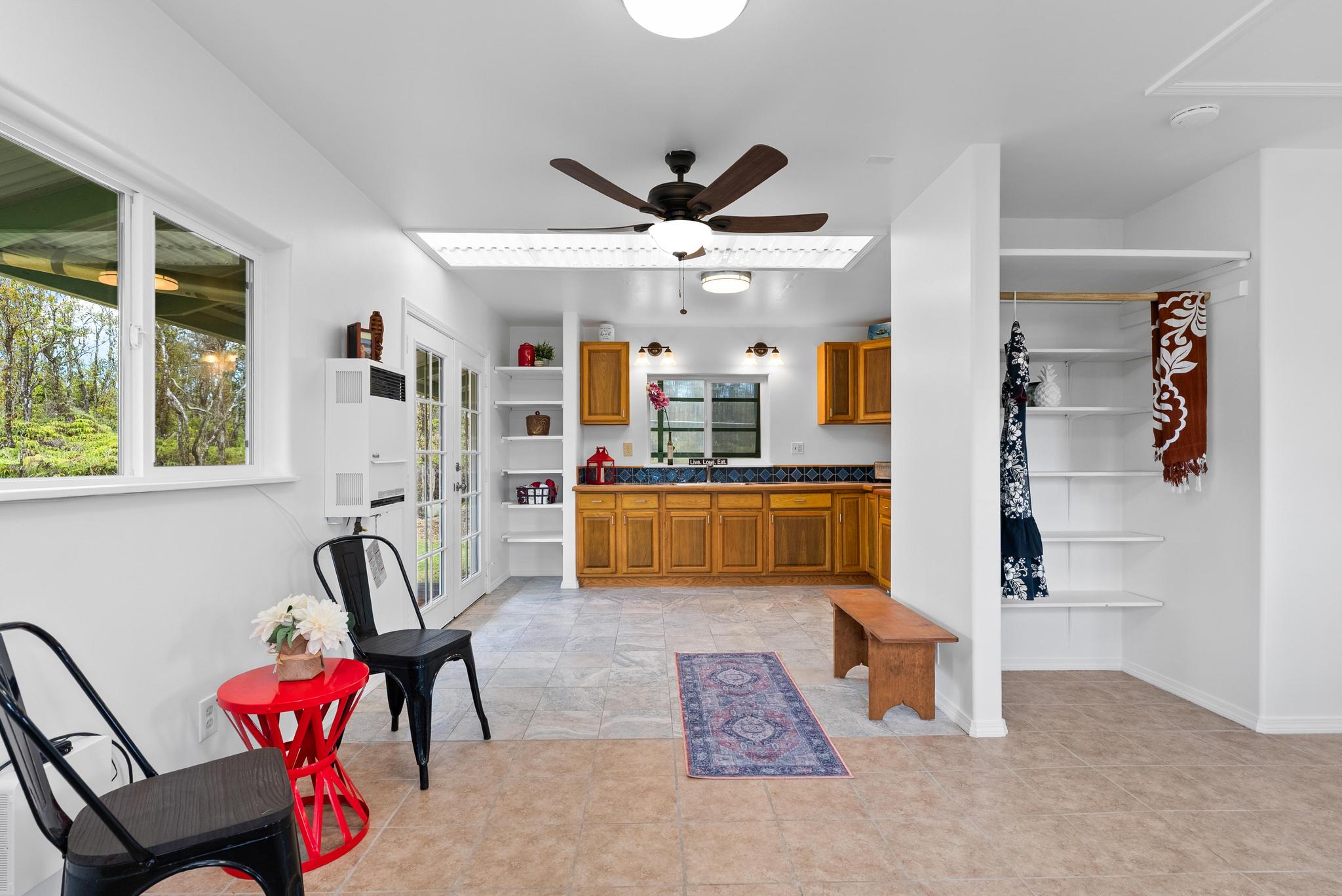 11-2449 Ohialani Road Mountain View, HI 96771 - Photo 4 of 10 a living room with furniture a rug and white walls