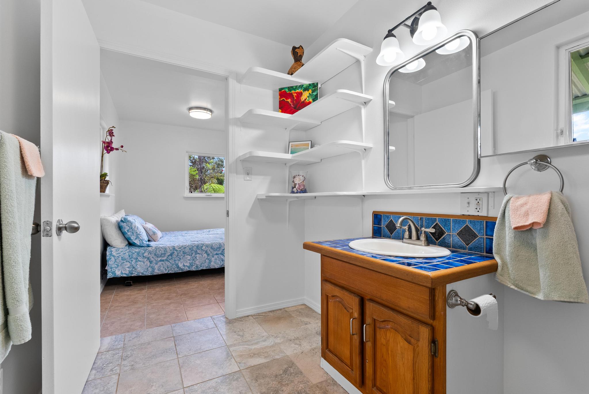 11-2449 Ohialani Road Mountain View, HI 96771 - Photo 7 of 10 a kitchen with a sink stove and cabinets