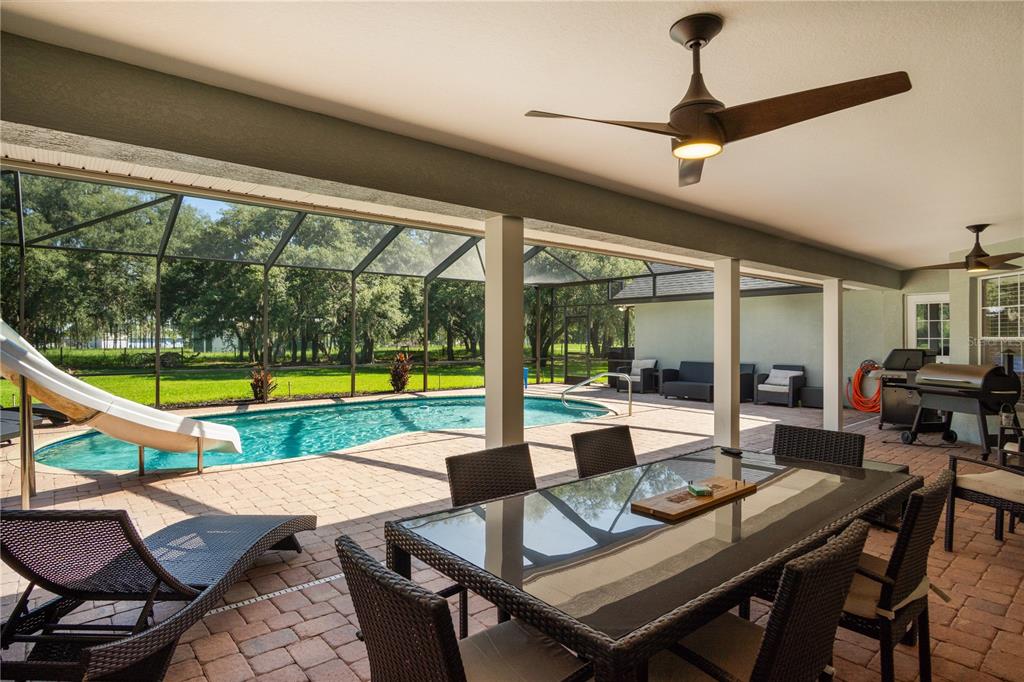 9045 Lake Hatchineha Road Kissimmee, FL 34759 - Photo 14 of 47 a view of a dining room with furniture window and outside view