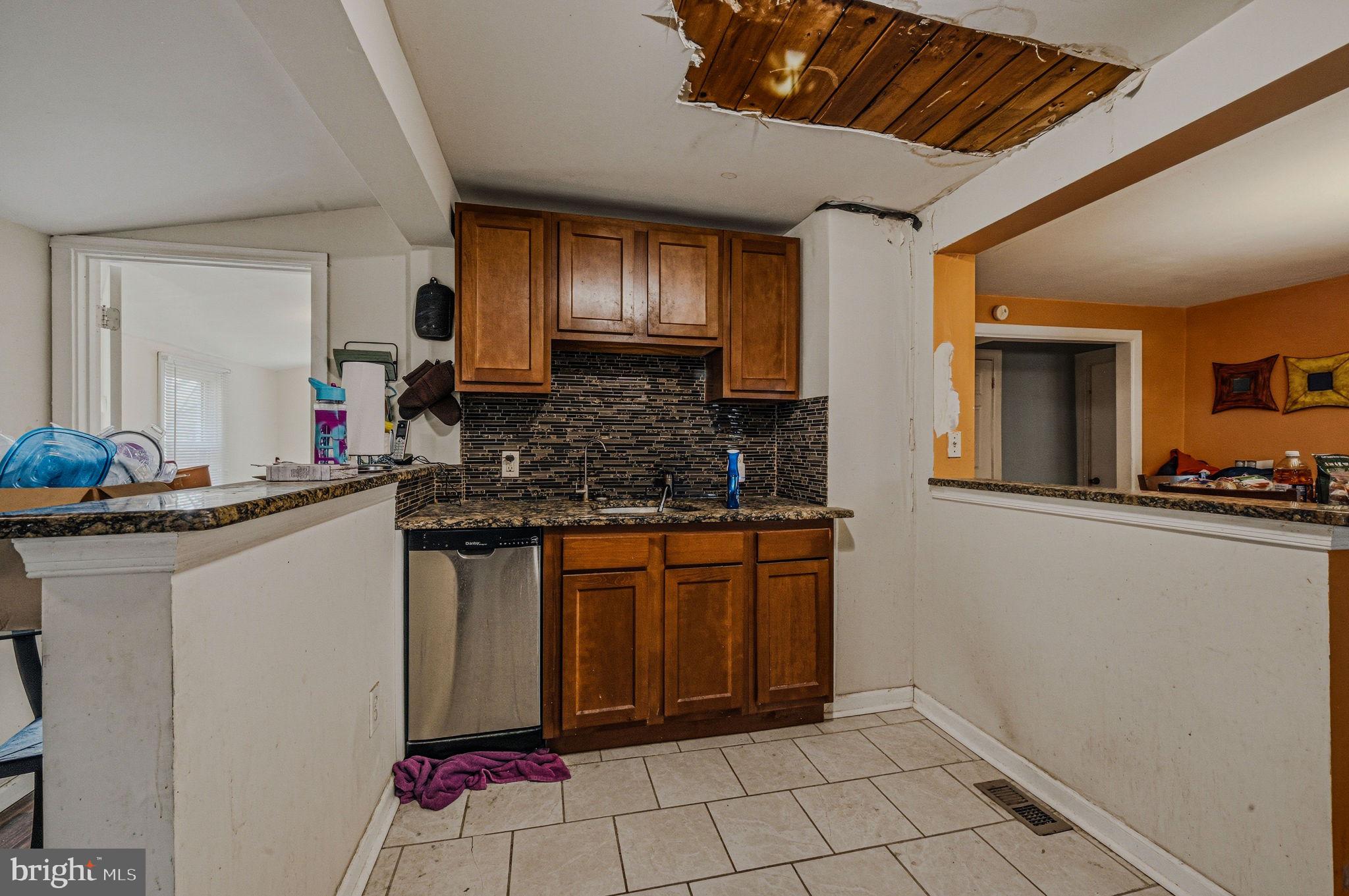 408 West 9th Street New Castle, DE 19720 - Photo 12 of 29 a kitchen with stainless steel appliances granite countertop a sink stove and cabinets