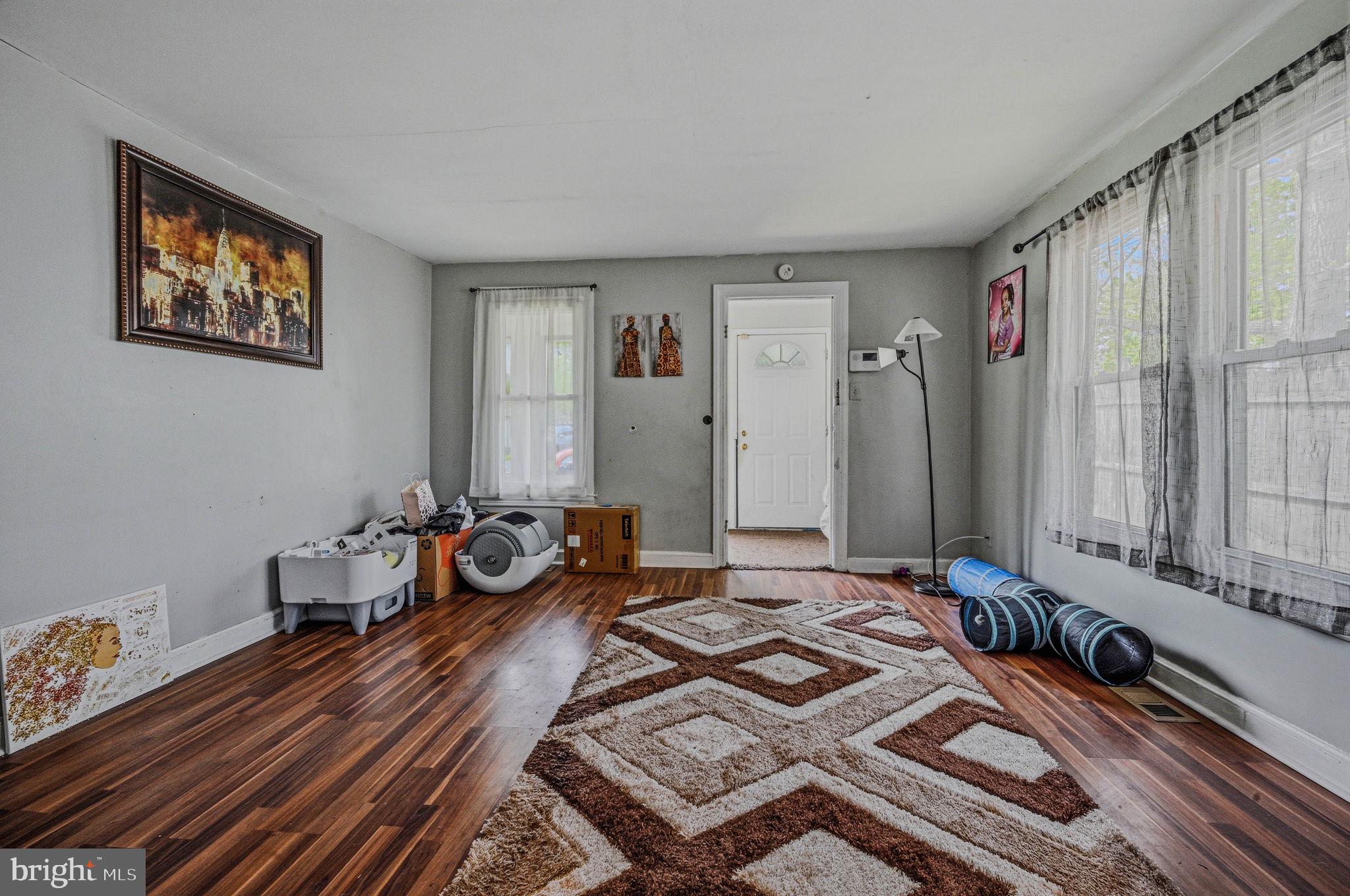 408 West 9th Street New Castle, DE 19720 - Photo 6 of 29 a bedroom with a bed and wooden floor