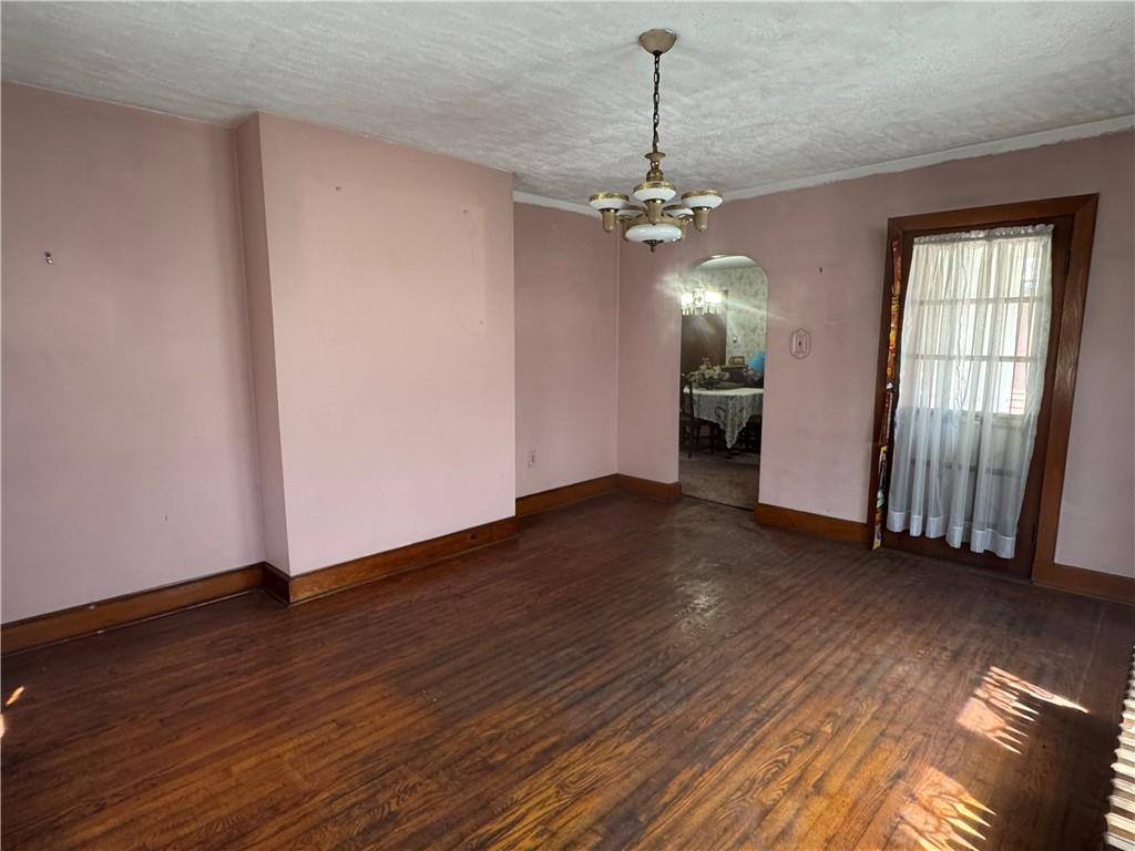 797 Walnut Hill Road Uniontown, PA 15401 - Photo 15 of 39 a view of a livingroom with a chandelier wooden floor and chandelier