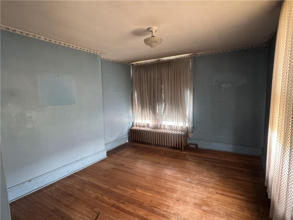 797 Walnut Hill Road Uniontown, PA 15401 - Photo 16 of 39 an empty room with wooden floor and windows