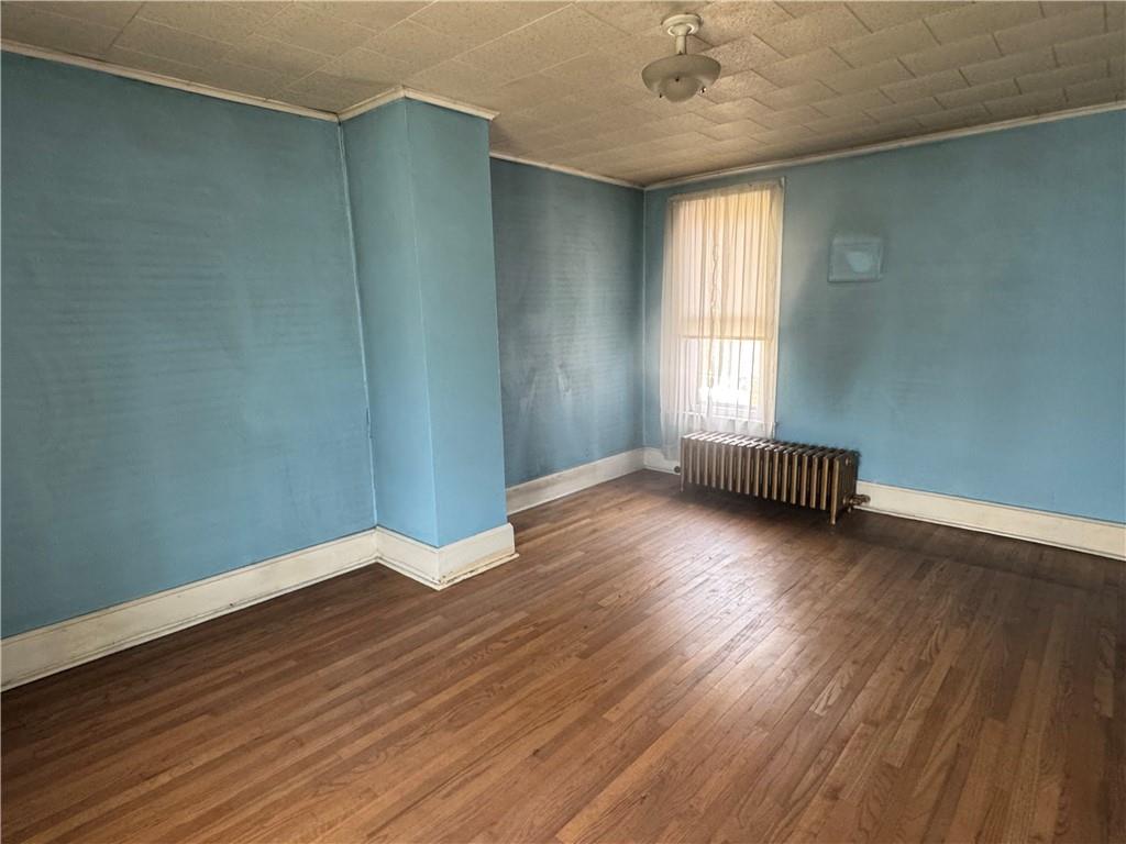 797 Walnut Hill Road Uniontown, PA 15401 - Photo 18 of 39 an empty room with wooden floor and windows